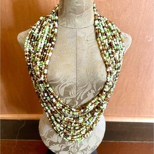 Fashion necklace,  10 inches long. Multi colored beads. Wooden clasp.